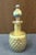 This 1983 Lundberg Studios art glass perfume bottle is beautifully designed with a stunning blue/green iridescent color....