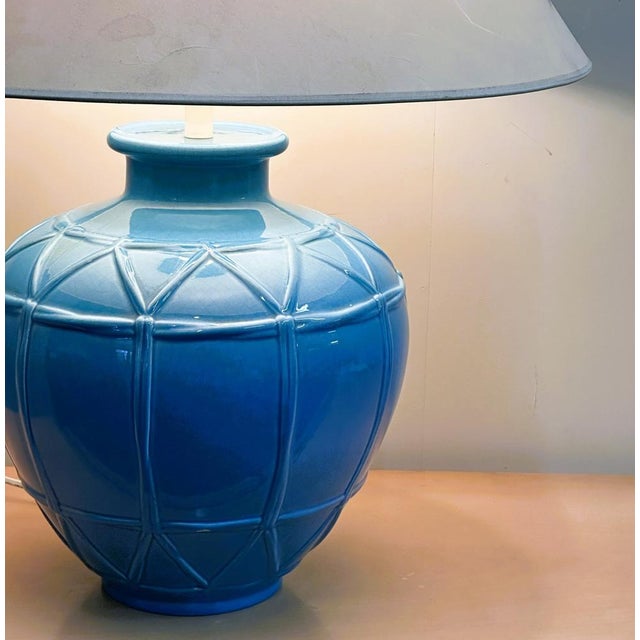 A striking mid-century french ceramic lamp by louis drimmer, known for his sculptural lighting designs and richly glazed...