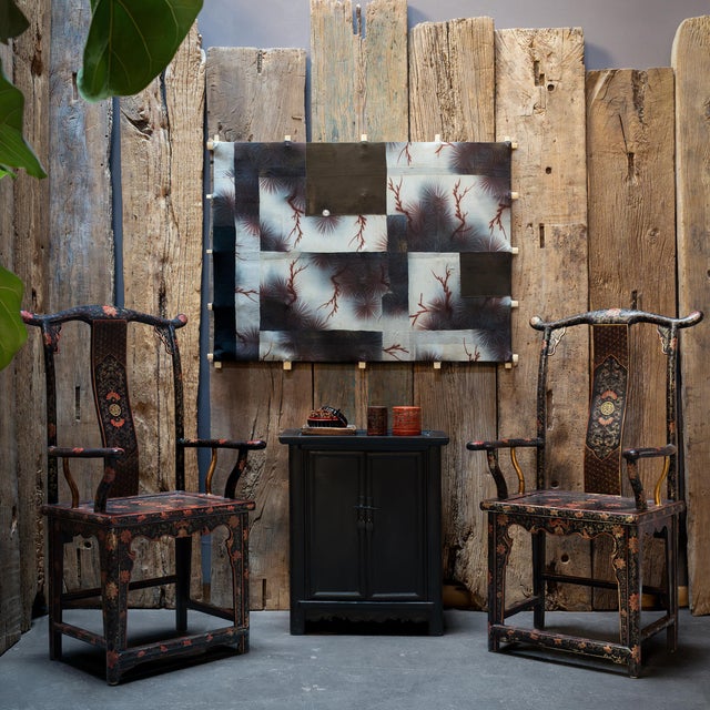 Crafted of elm with a dark lacquer finish, this small locking cabinet from the mid-19th century embodies the refined...