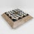 A spectacular lidded box designed by Maitland-Smith in the 1980s, rendered in tessellated marble, stone, travertine, and...