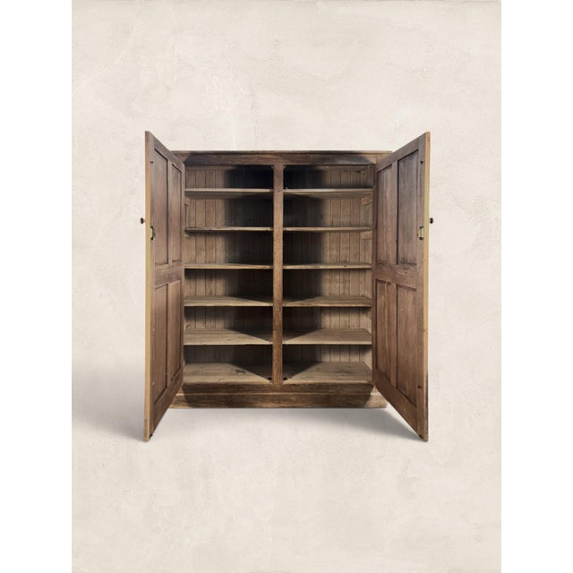 A handsome English oak housekeeper’s cupboard dating to circa 1900, offering generous storage behind a pair of paneled...