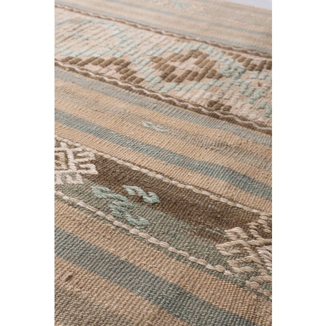 This vintage Turkish flat weave Kilim is hand-woven. The simplicity and boldness of this piece can also give a...
