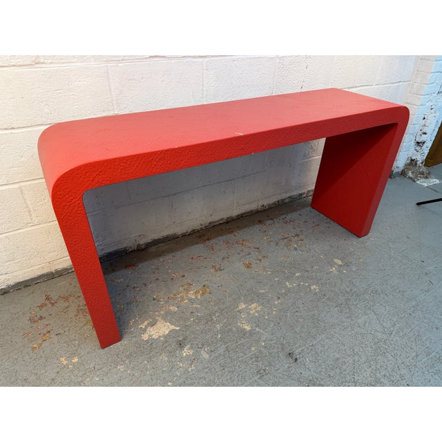 Make a bold statement with this iconic 1980s post-modern console table. Featuring a classic minimalist waterfall...