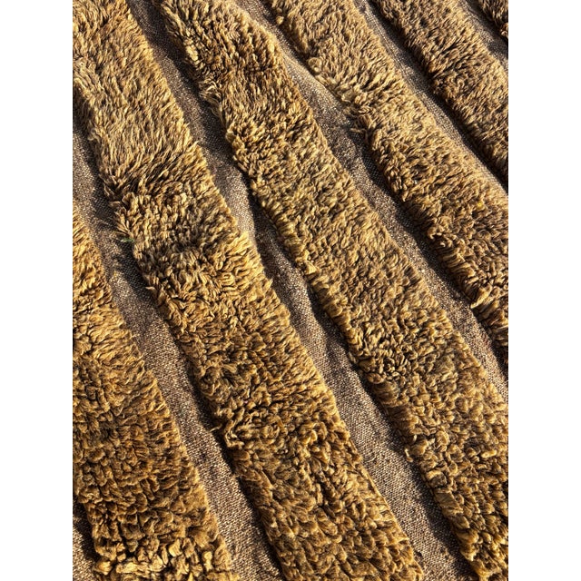 This Moroccan Mrirt Beni Ouarain rug is a handwoven piece created by skilled artisans from the Middle Atlas region of...