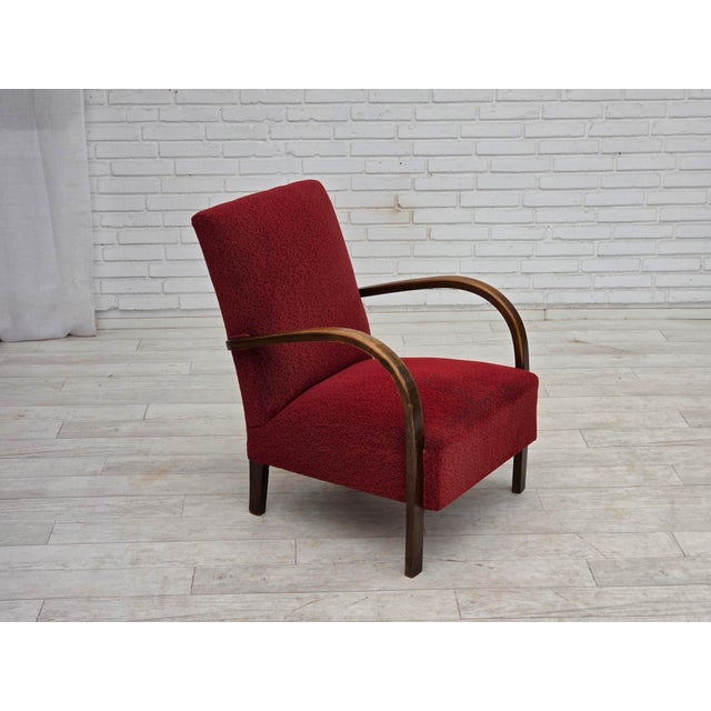 1950s, Danish artdeco armchair. Original red furniture wool, beech wood armrests/legs, brass springs in the seat. Original...