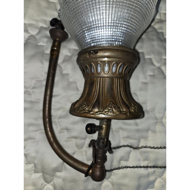 Converted antique gas wall lamp. Someone tried to convert it to an electric lamp but never finished. It is partially...