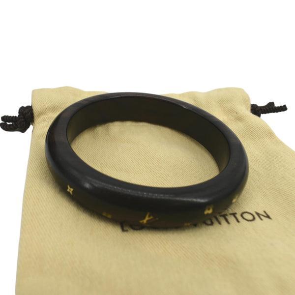 Elevate your accessory game with the exquisite Louis Vuitton Black Bangle, a stunning piece that seamlessly blends luxury...