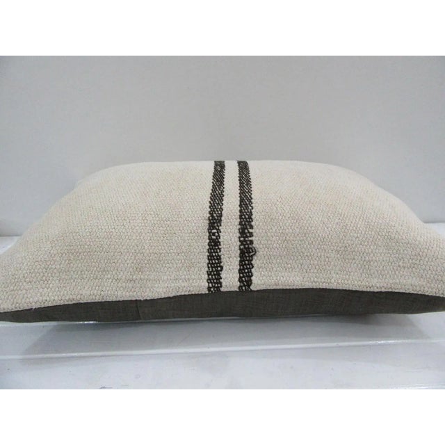 This is a pillow cover made from a vintage kilim rug. The piece was properly washed and ready to use. Pillow inserts not...