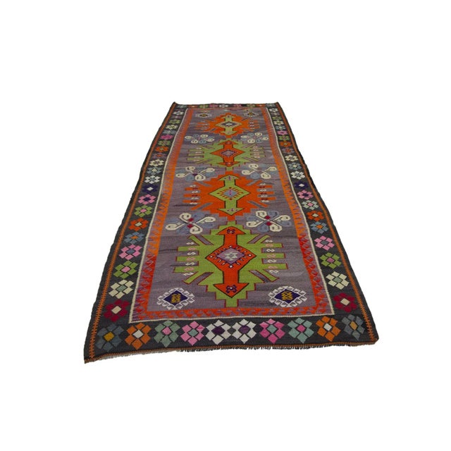 Vintage handwoven decorative kilim rug from Kars region of Turkey. Approximately 50-60 years old. In very good condition.