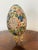 Gorgeous 7” large polychrome enamel cloisonné egg on gold brass stand.