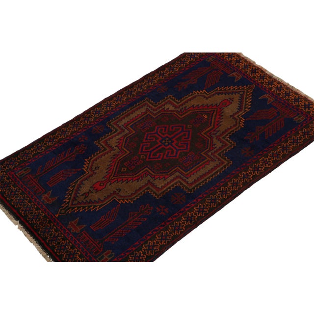 Hand knotted in wool, this 3x5 Baluch scatter rug represents a new line of tribal carpets in the Modern Classics...