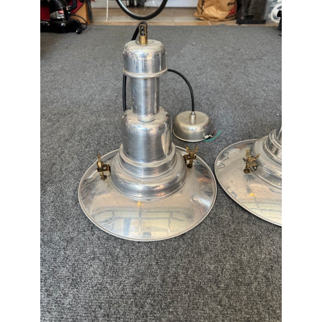 Rare and highly sought after vintage IKEA OTTAVA polished Aluminum pendant lighting. Perfect for an industrial finish to...