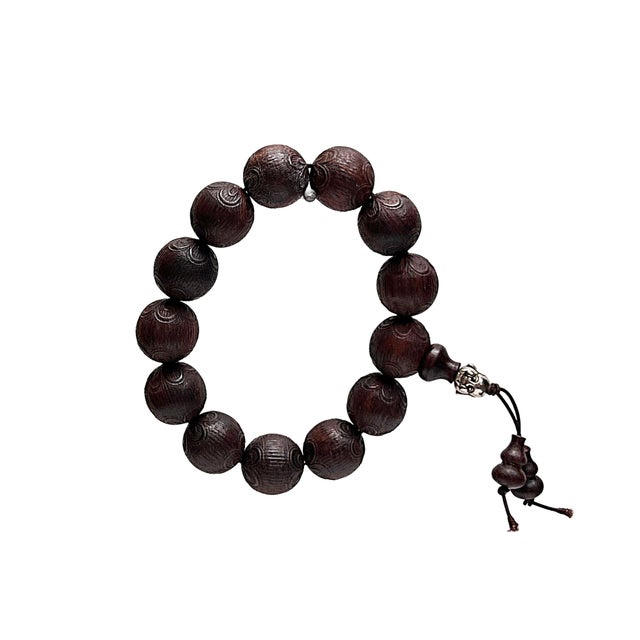 Discover tranquility and timeless elegance with our exquisite Dark Brown Carved Round Beads Hand Prayer Rosary Bracelet....
