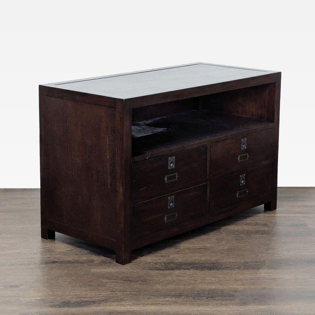 This Pottery Barn entertainment center offers a classic dark wood finish and sturdy build. It features four spacious...
