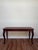 Regency-inspired foyer/console table by Polo Ralph Lauren, crafted in richly finished mahogany with sculptural carved...