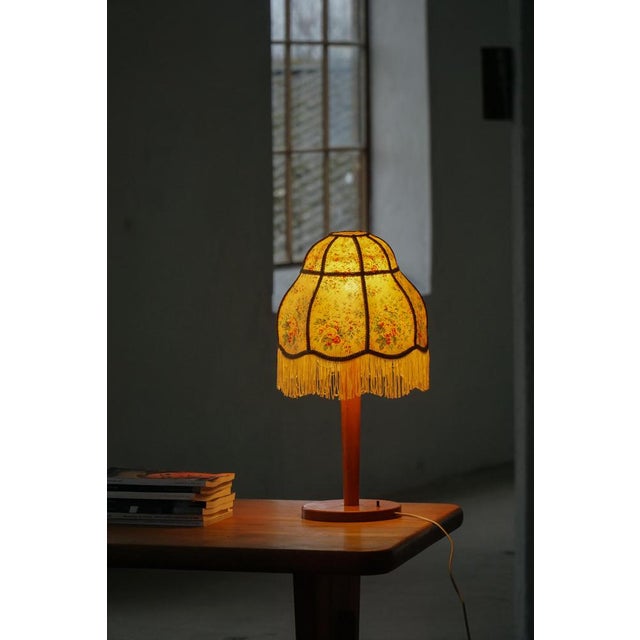 This charming vintage table lamp reflects the romantic elegance often associated with Art Deco lighting. Designed to...