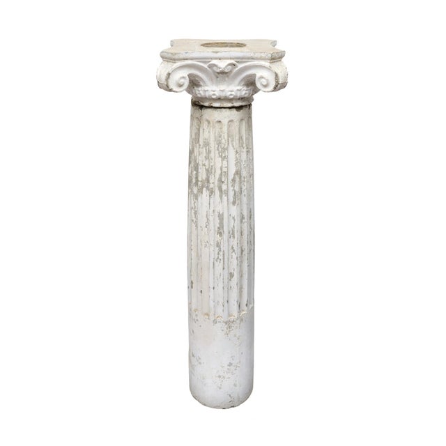 Column from France made of concrete and showcasing the original patina and painted finish. This fluted column is topped...
