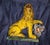 This is a vintage Italian majolica or faience ceramic figurine of a Medici-style lion resting its paw on an armorial...