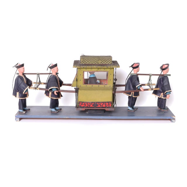 Rare and unusual antique Chinese sculpture or model depicting a Manchurian sovereign carried on a palanquin by four...