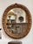 A finely carved Louis XIV period oval mirror, 18th century, retaining its original gilding with rich, time-worn patina....