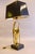 Sculptural table lamp from the 1970s, with a fluid abstract hand-form figure in solid cast brass on a black wood plinth....