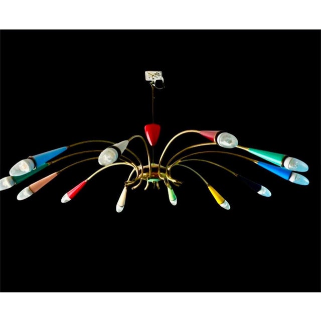 Striking mid-century Italian “spider” chandelier, attributed to Stilnovo, Milan, circa 1950-1955. The radiating structure...