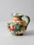 This is a vintage Italian sgraffito majolica pottery pitcher. The hand-painted pitcher has a classic floral design in a...