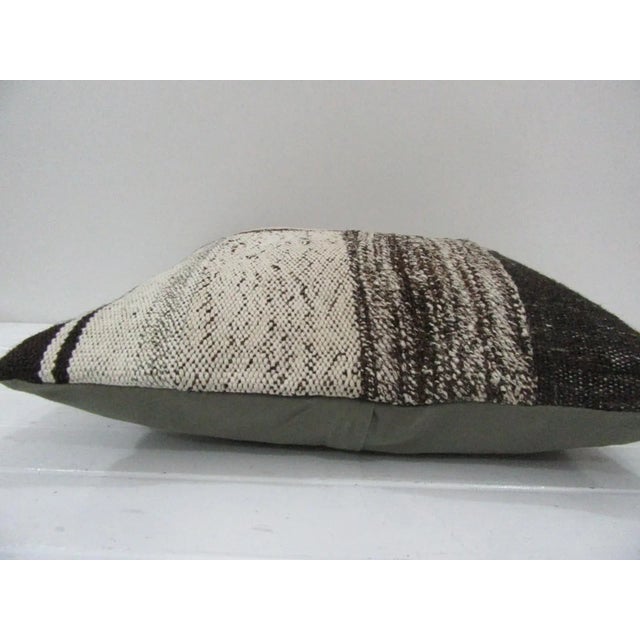 This is a pillow cover made from a vintage kilim rug. The piece was properly washed and ready to use. Pillow inserts not...