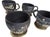 Handcrafted ceramic mugs feature a charming, artisan aesthetic with a matte black finish that serves as a canvas for...