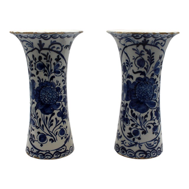 Circa 1800 pair of Delft blue and white vases, Dutch. Decoration after Chinese peony designs of the Kangxi period....