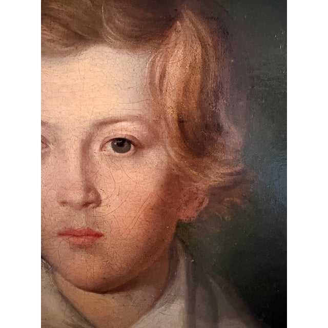 Young Dutch Man in a Green Shirt Oil on panel, 19th-century Holland This portrait depicts a young man with light red hair...