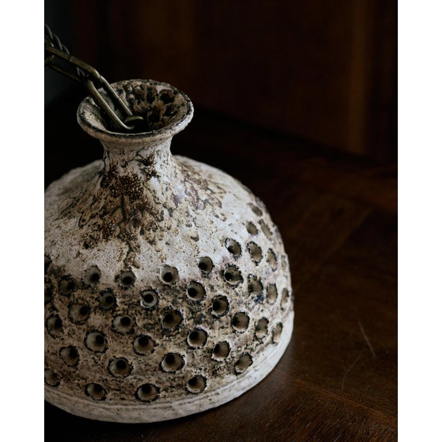 Dating back to the 1970s, this Danish ceramic pendant light has been newly rewired to function in any space. The ceramic...