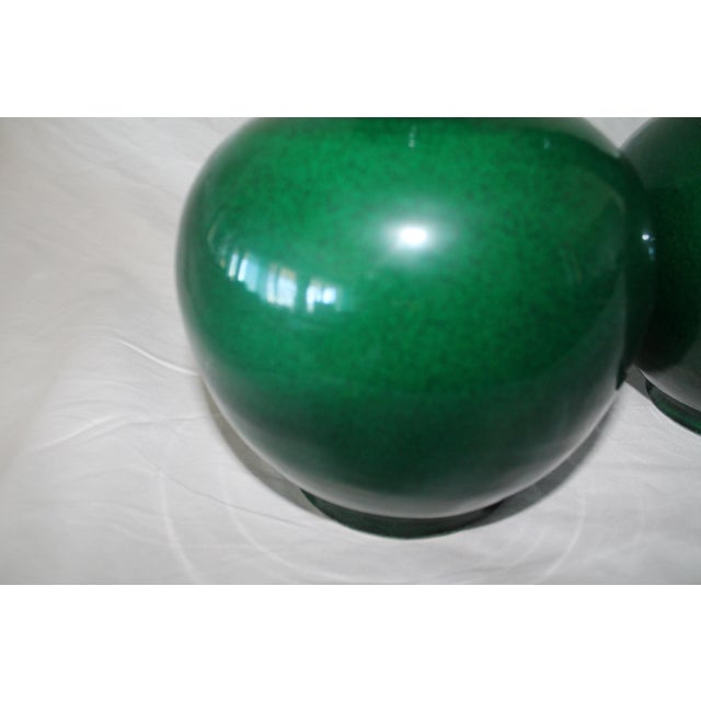 Pair of 19th Century Chinese Green Porcelain Vases Description A refined pair of 19th century Chinese porcelain vases in a...