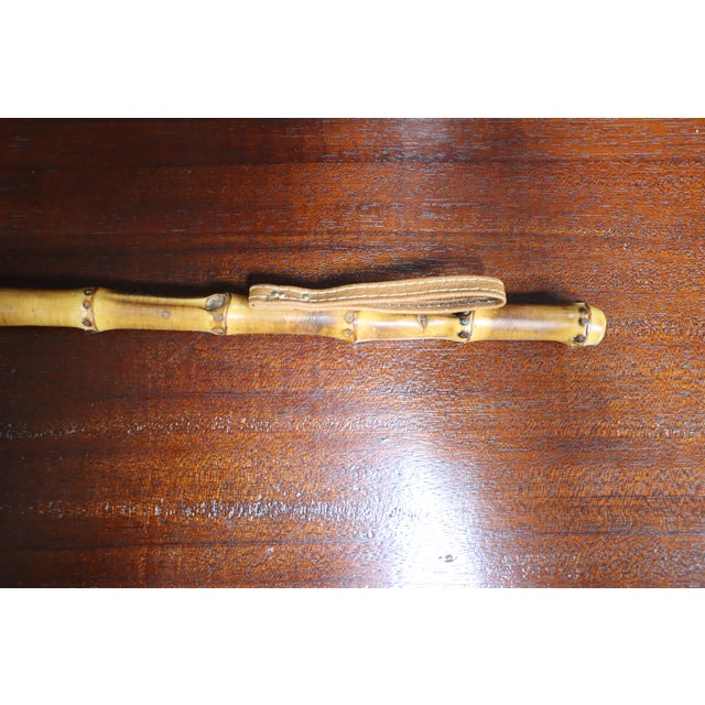 Vintage decorative shoe horn with bamboo handle.