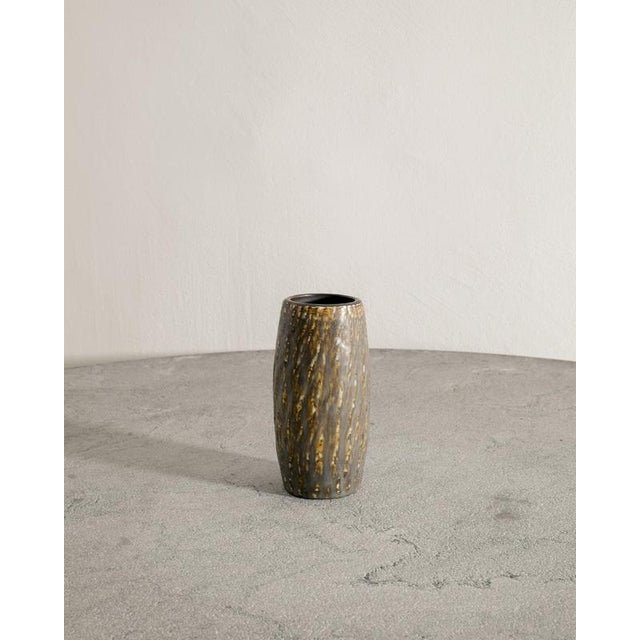 Rare vintage Swedish mid century decorative ceramic vase in brown golden glaze from the series "Rubus" designed by Gunnar...