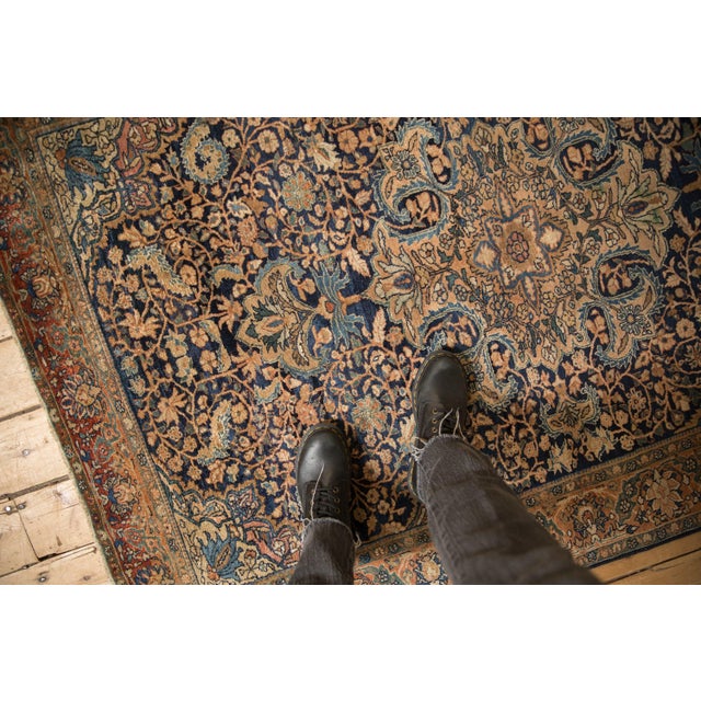 :: Oversized center medallion with outwardly directed trefoil contour finials atop an intricate scrolling vine main field...