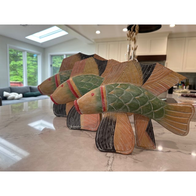 Hand-carved and painted wooden fish sculptures. Artist marking underneath the mouth of each sculpture (see pictures)....