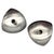 A refined pair of Danish modern stainless steel taper candle holders attributed to Stelton Denmark, exemplifying the...