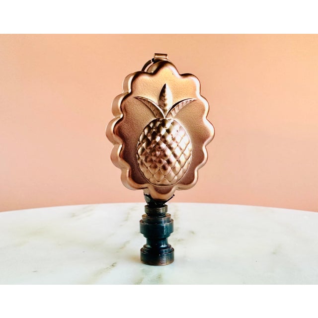 Lamp finial crafted from a miniature copper baking mold sized to fit a standard-size lamp harp with a 1/4" stem.