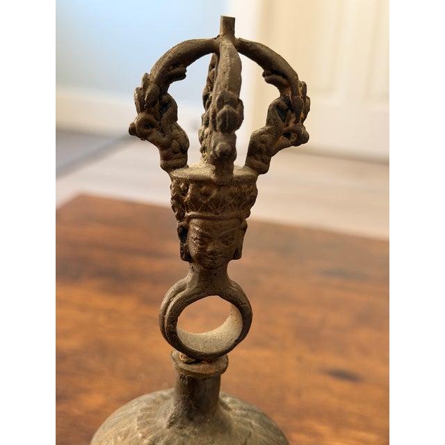 This is a vintage Tibetan Buddhist ritual hand bell, traditionally known as Drilbu in Tibetan. It is an instrument used in...
