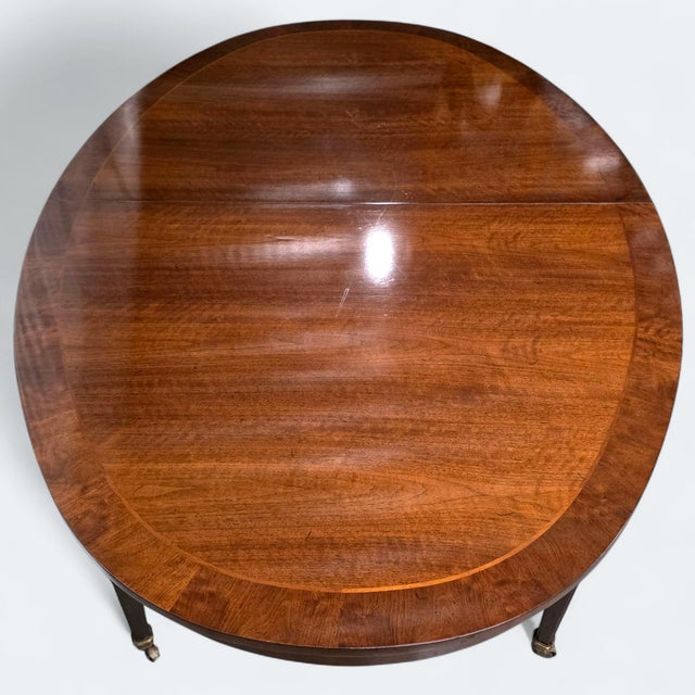 This Vintage Baker Furniture Oval Dining Table is sophisticated with understated elegance and an easily integratable...