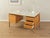 A classic freestanding desk from the 1960s by Arne Vodder. High-quality oak veneer cabinet with three drawers, one door,...
