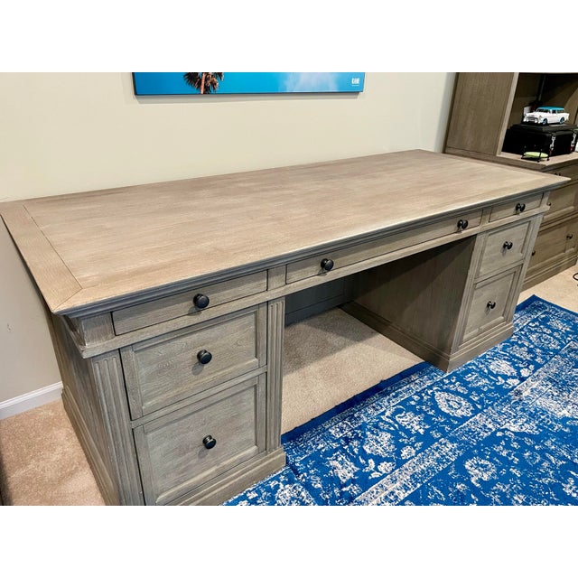 Classic executive desk crafted of meranti wood in Grey Wash finish. Crown molding and fluted trim. Excellent condition....