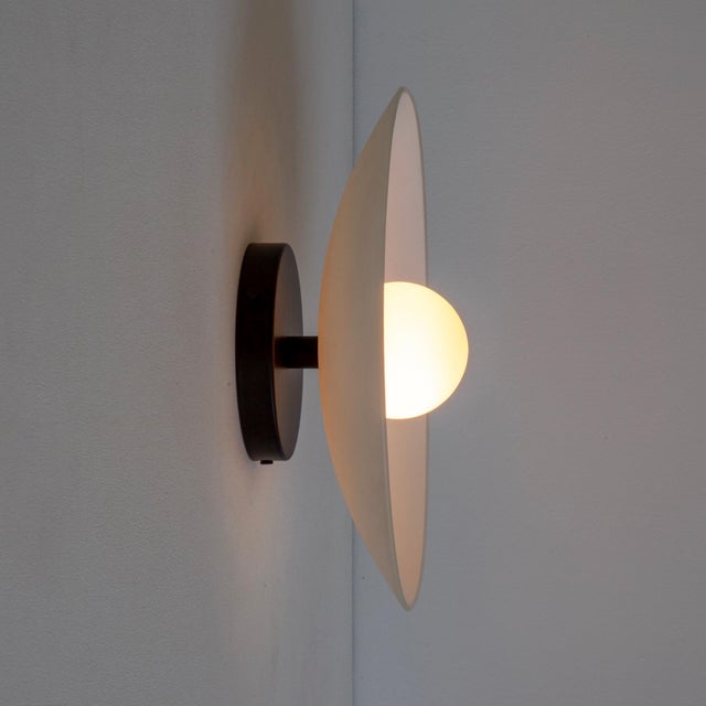 Half-glass, all glow. The Dish Sconce delivers soft light with playful elegance. Feels good on the wall. Materials Steel,...