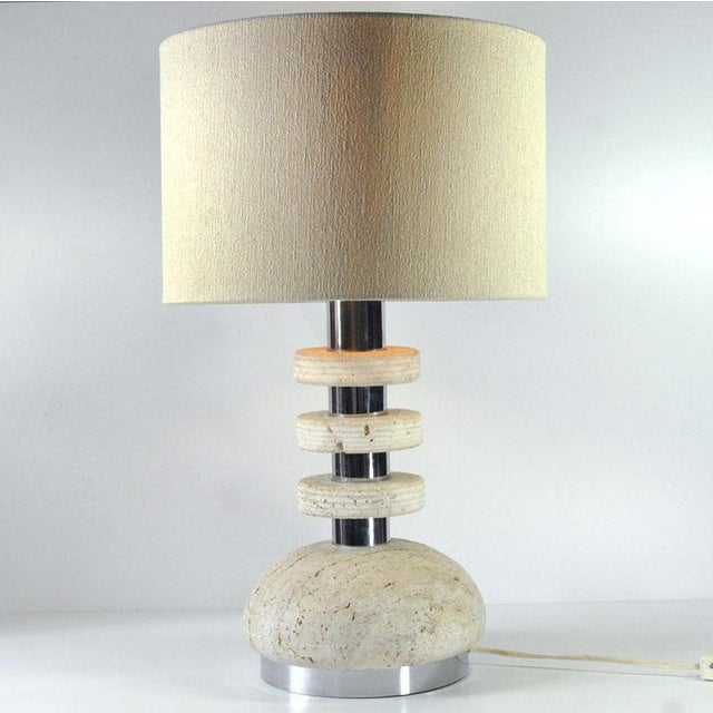 A large, heavy, extremely impressive, brutalist lamp with a stone base from Italy. It is handmade from travertine. It...