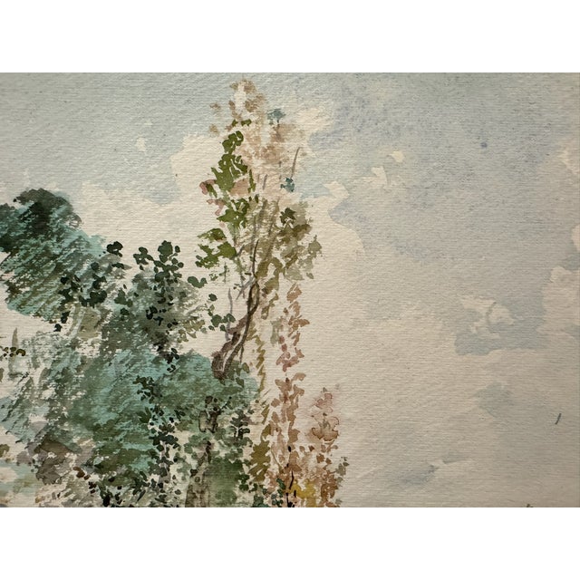 Original watercolor on textured paper depicting a quiet woodland stream with reflective water, tall trees, rocky banks and...