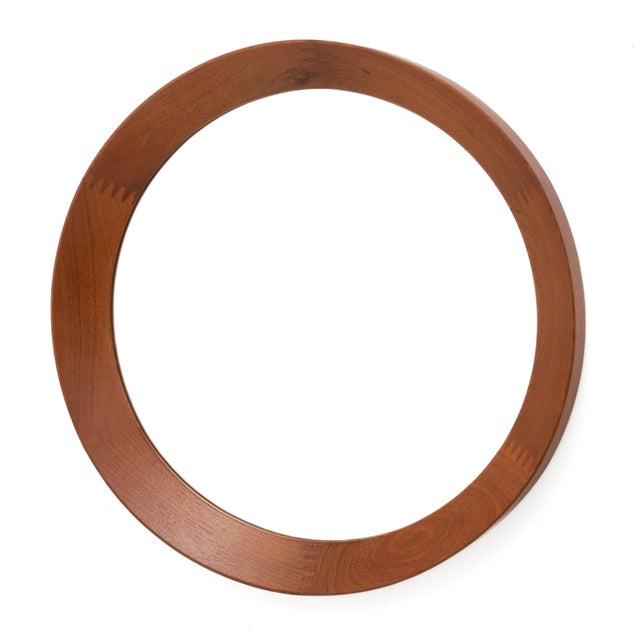 A large and round Pedersen & Hansen Viby J. Danish teak wall or hall mirror. Simple and elegant, solid teak with...