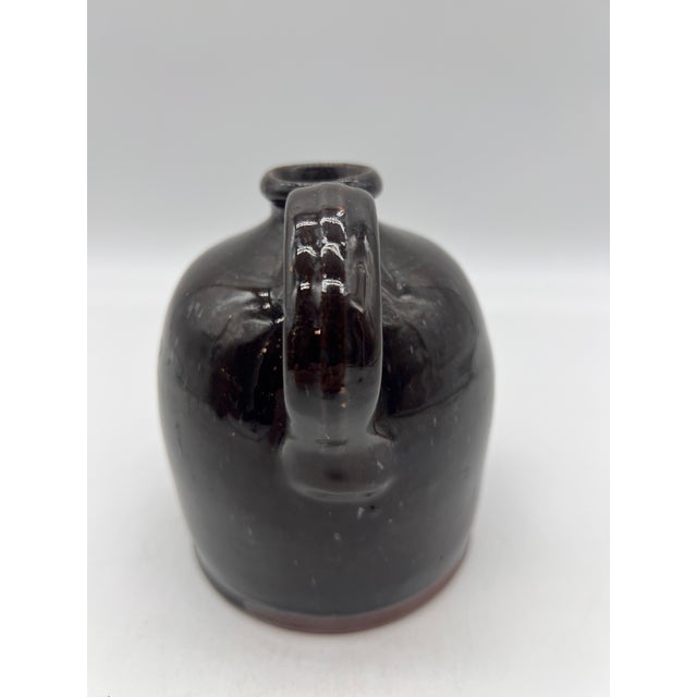 A Fine Antique Pennsylvania Folk Art Redware Handled Jug With an Albany Glaze, 1870's Most likely made in Lancaster or...