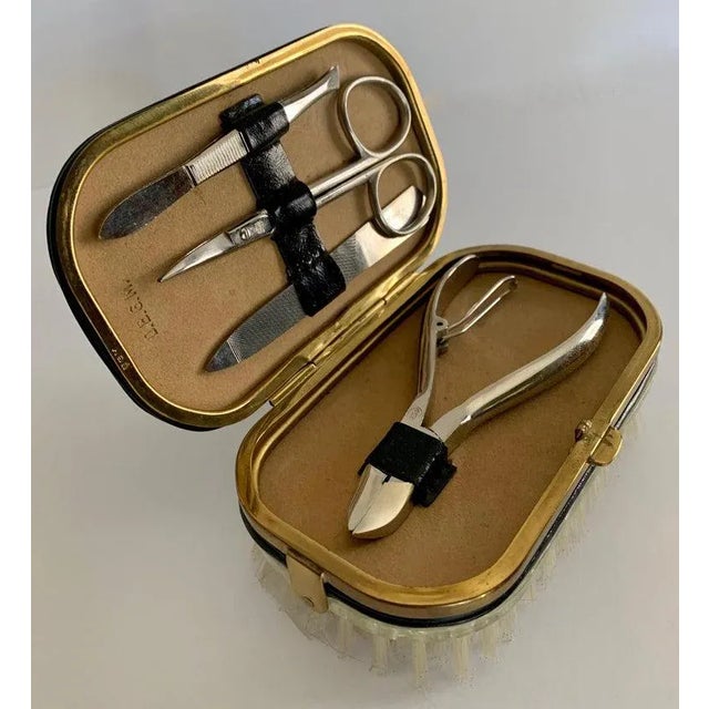 A handsome compliment to the men's dressing table, dressing room or Valet. The attractive Garment brush, with brass trim,...