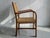 Elegant Swedish Modern armchair designed by Axel Larsson and produced by Bodafors in Sweden during the 1930s. The chair...